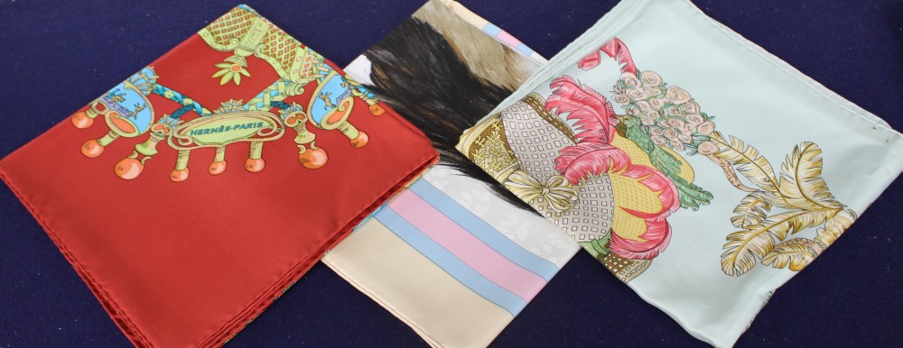 Three Hermes silk scarves, with one original Hermes orange card box